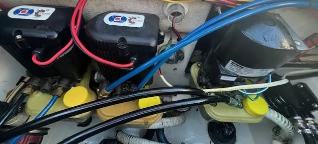 Slide: The Image of Electrical components and wiring inside a 2003 Hydra-Sports Bay Bolt 2300 boat. - 19