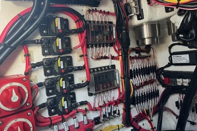 Slide: The Image of Electrical wiring and components inside a 2003 Hydra-Sports Bay Bolt 2300 boat. - 22