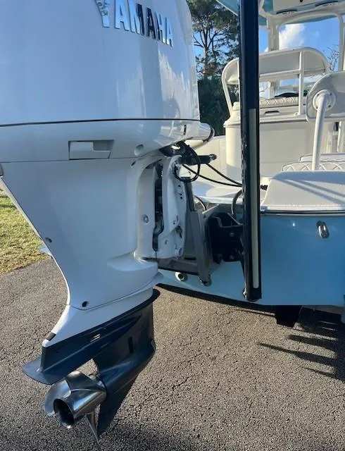 Slide: The Image of 2003 Hydra-Sports Bay Bolt 2300 with Yamaha outboard motor, parked on pavement. - 4