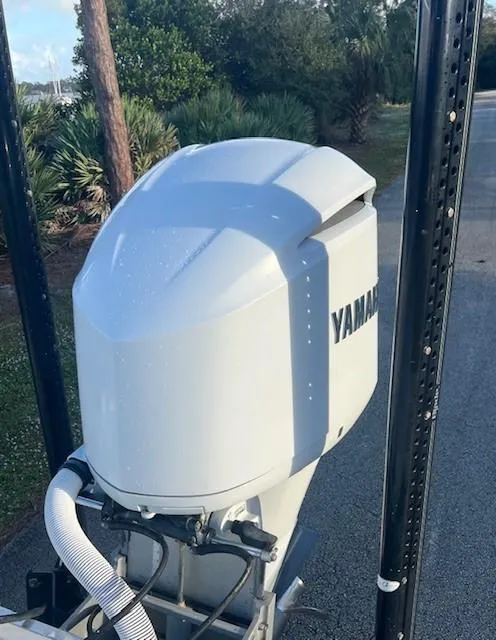 Slide: The Image of 2003 Hydra-Sports Bay Bolt 2300 with Yamaha outboard motor, parked on a road. - 5