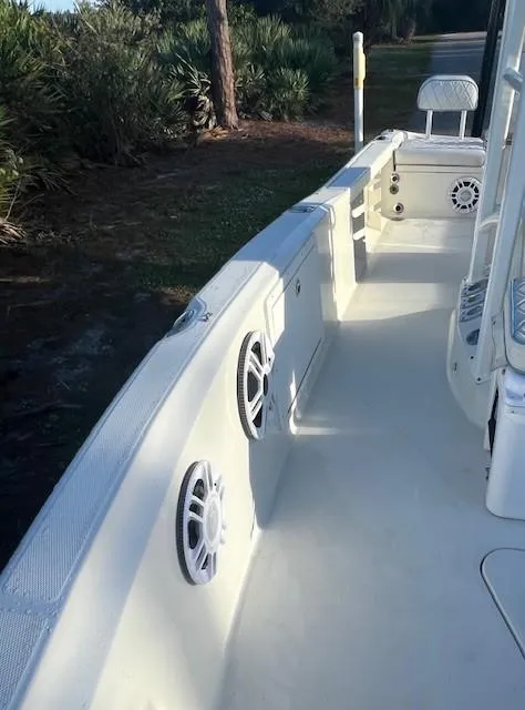 Slide: The Image of 2003 Hydra-Sports Bay Bolt 2300 boat interior with speakers and seating. - 7