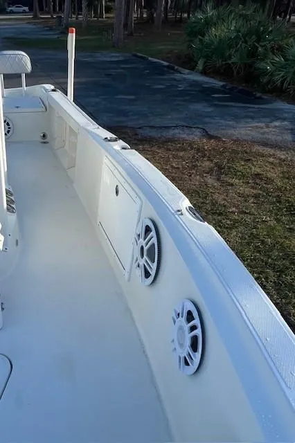 Slide: The Image of 2003 Hydra-Sports Bay Bolt 2300 boat interior with speakers and storage compartments. - 8