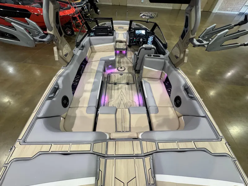 Slide: The Image of 2025 Supra SL boat interior with modern seating, ambient lighting, and advanced dashboard controls. - 18