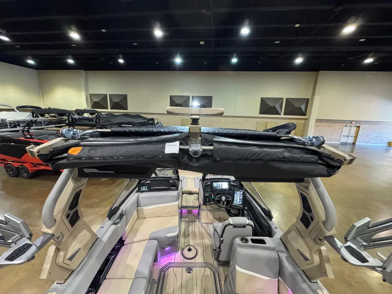 Slide: The Image of 2025 Supra SL boat interior with advanced dashboard and seating, showcased indoors. - 19