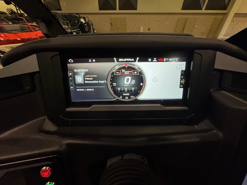 Slide: The Image of 2025 Supra SL dashboard display with digital speedometer and Bluetooth connectivity options. - 27