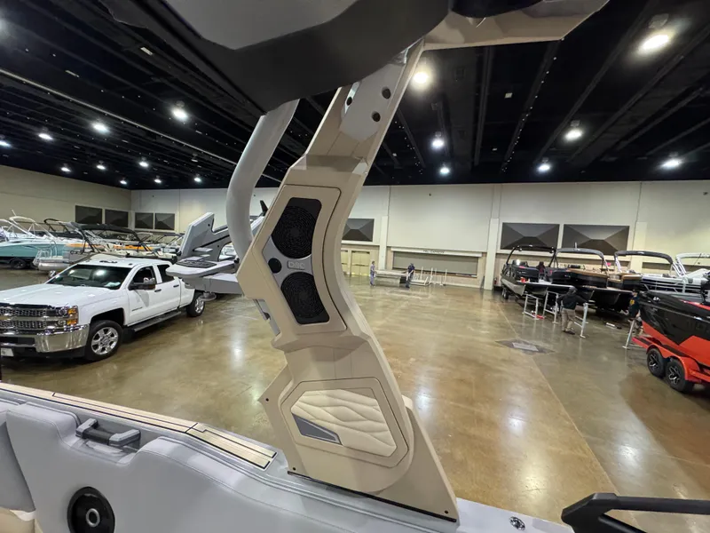 Slide: The Image of 2025 Supra SL boat interior at an indoor showroom, showcasing sleek design and modern features. - 35