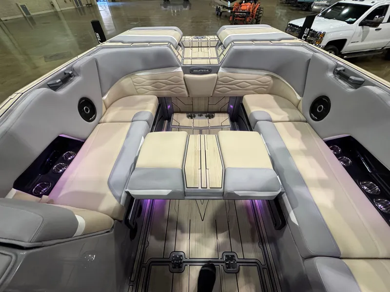 Slide: The Image of Luxurious 2025 Supra SL boat interior with plush seating and ambient lighting. - 46