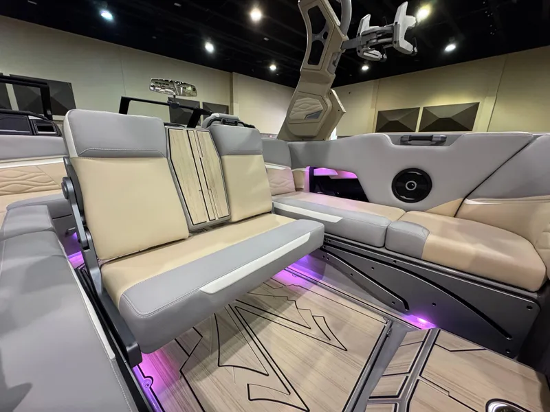 Slide: The Image of Luxurious interior of 2025 Supra SL boat with beige seating and ambient lighting. - 48
