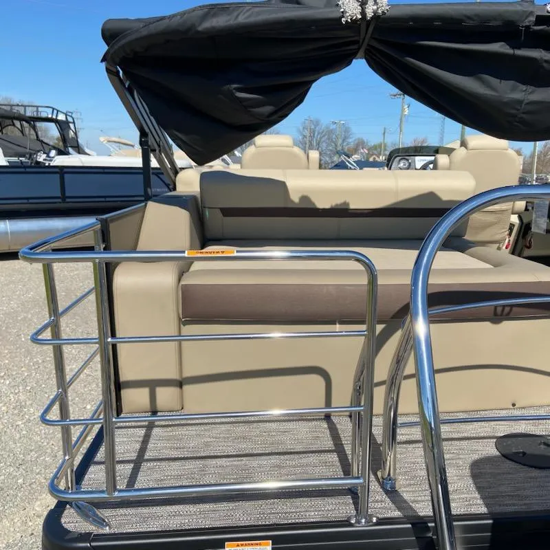 Slide: The Image of 2024 Godfrey Sweetwater SW2286SFL pontoon boat with beige seating and stainless steel railing. - 3