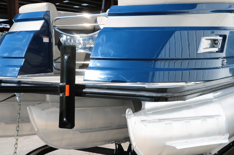 Slide: The Image of 2022 Silver Wave 2410 SW5 CLS pontoon boat, blue and white exterior, rear view. - 13