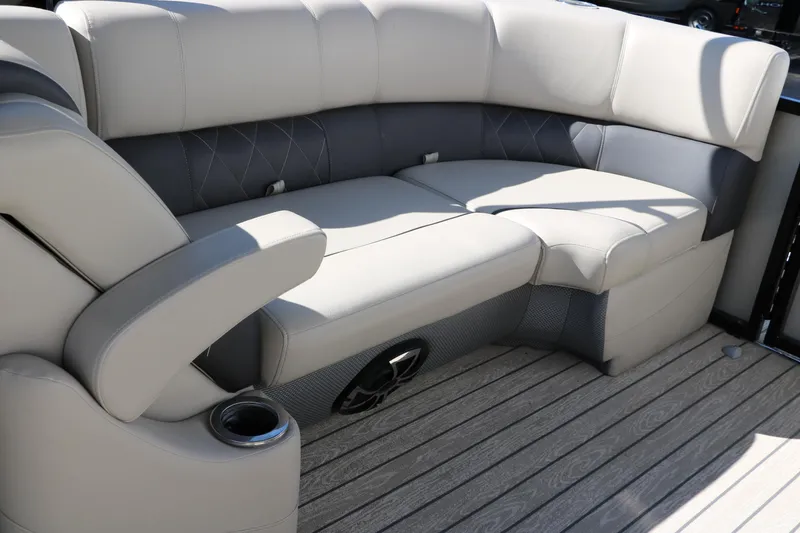 Slide: The Image of Luxurious seating on 2022 Silver Wave 2410 SW5 CLS boat, featuring plush cushions and cup holder. - 36
