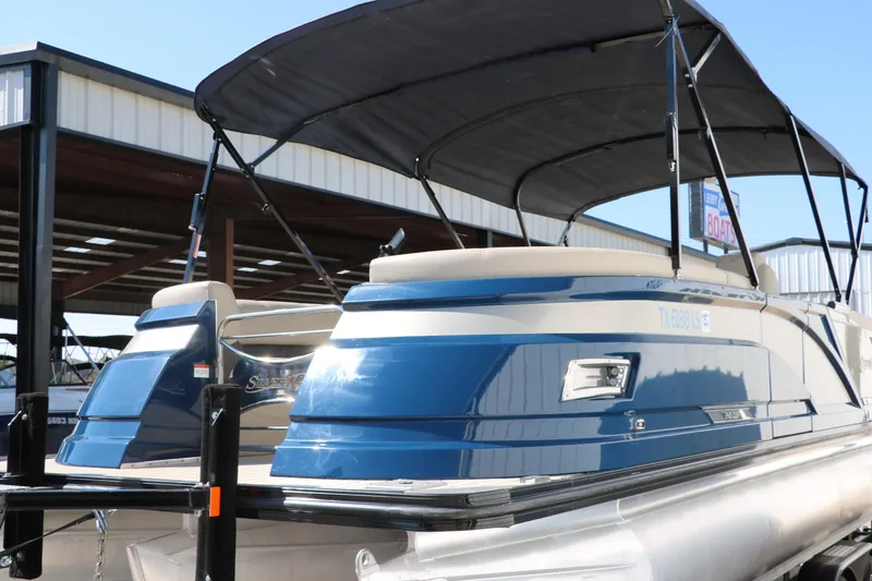 Slide: The Image of 2022 Silver Wave 2410 SW5 CLS pontoon boat with blue exterior and canopy. - 39