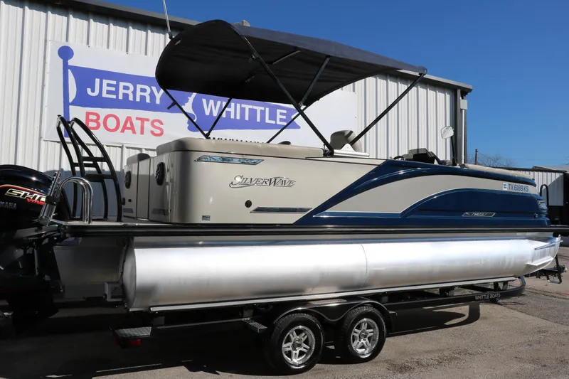 Slide: The Image of 2022 Silver Wave 2410 SW5 CLS pontoon boat displayed at Jerry Whittle Boats dealership. - 6