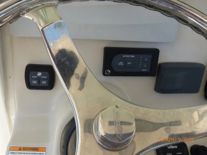 Slide: The Image of Steering wheel and controls of a 2018 Boston Whaler 250 Outrage boat. - 37