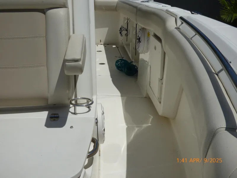 Slide: The Image of 2018 Boston Whaler 250 Outrage interior, featuring seating and storage compartments. - 42