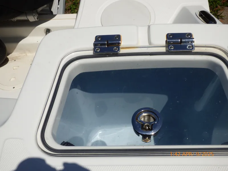 Slide: The Image of 2018 Boston Whaler 250 Outrage livewell with stainless steel hinges and latch. - 44