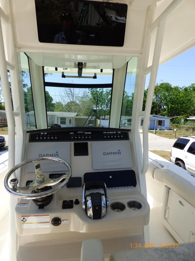 Slide: The Image of 2018 Boston Whaler 250 Outrage helm with Garmin navigation system and steering wheel. - 24