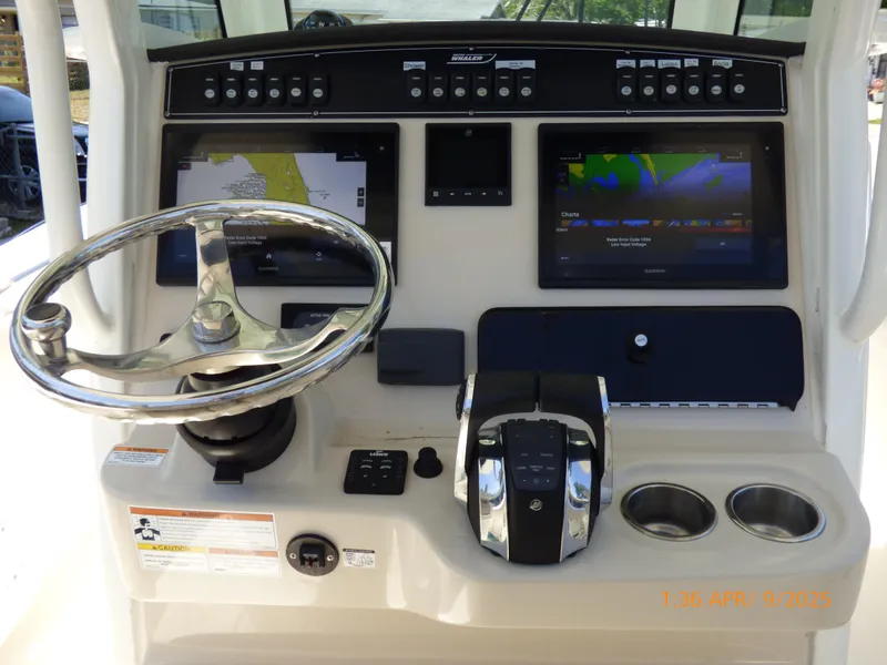 Slide: The Image of 2018 Boston Whaler 250 Outrage helm with advanced navigation displays and controls. - 26