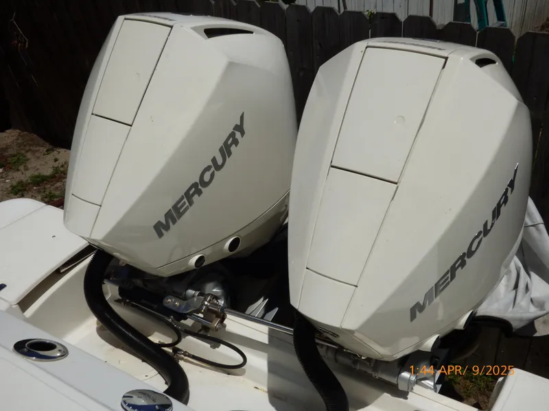 Slide: The Image of Twin Mercury outboard engines on a 2018 Boston Whaler 250 Outrage boat. - 47