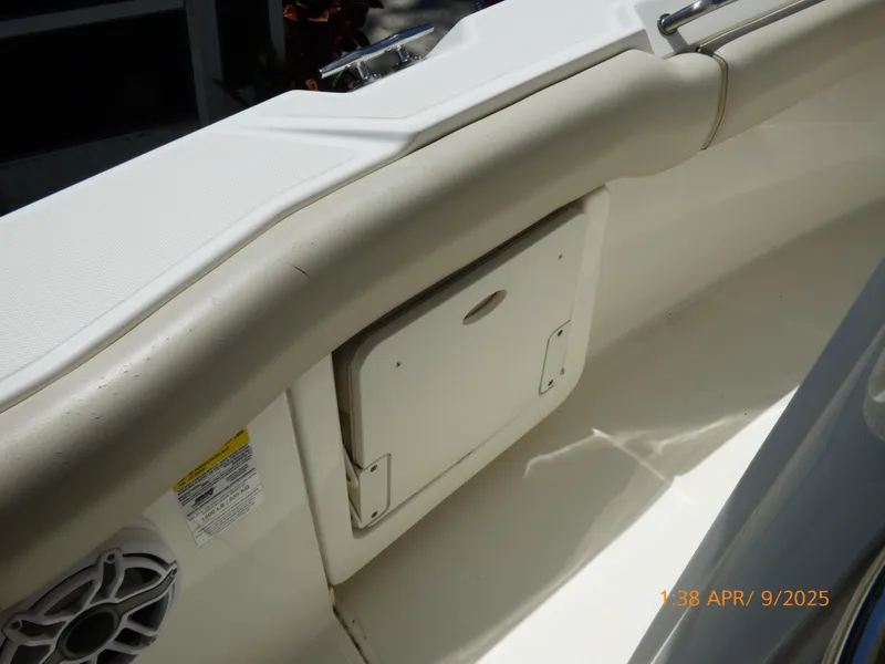 Slide: The Image of Interior view of a 2018 Boston Whaler 250 Outrage boat, featuring a storage compartment. - 35