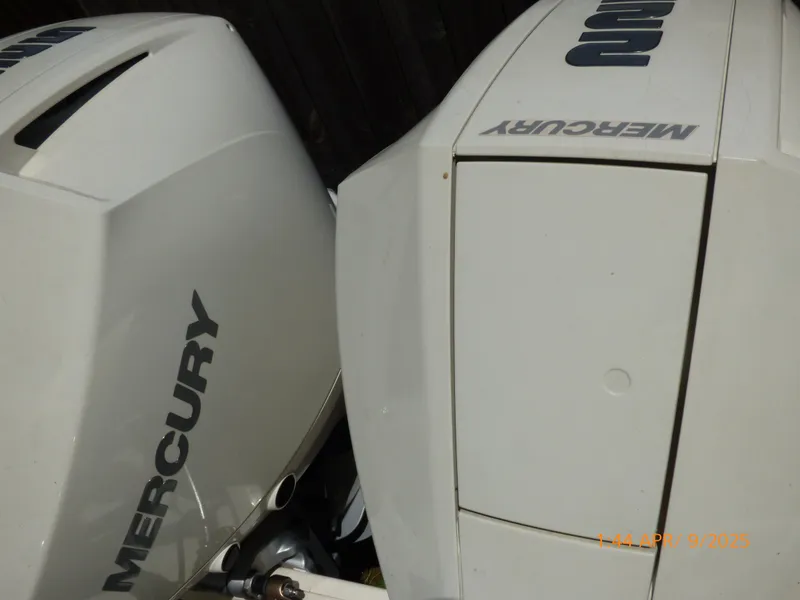 Slide: The Image of Twin Mercury outboard engines on a 2018 Boston Whaler 250 Outrage boat. - 48