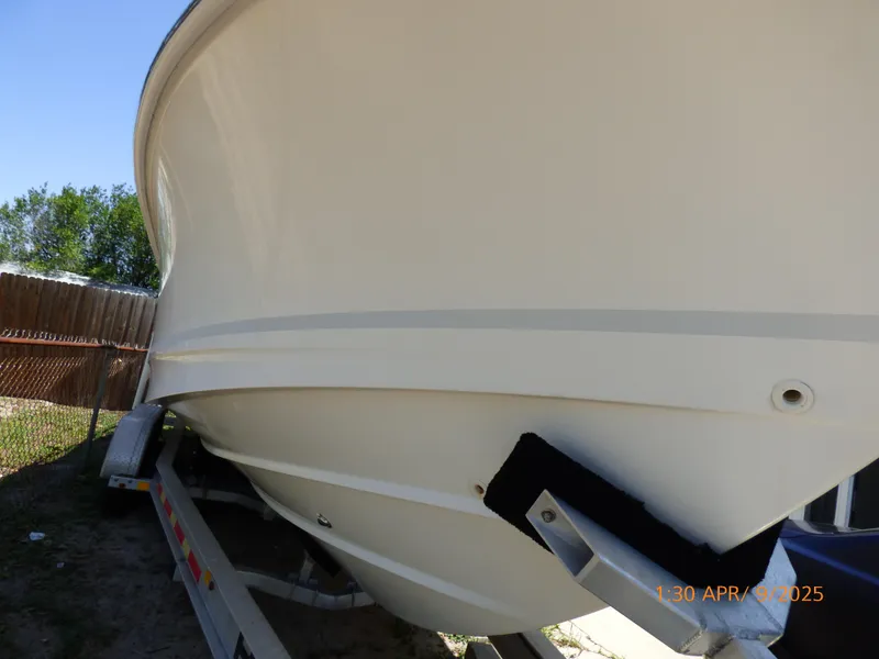 Slide: The Image of 2018 Boston Whaler 250 Outrage boat on trailer, side view. - 9