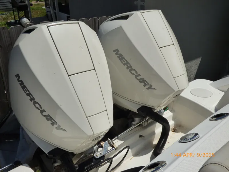 Slide: The Image of Twin Mercury outboard engines on a 2018 Boston Whaler 250 Outrage boat. - 46