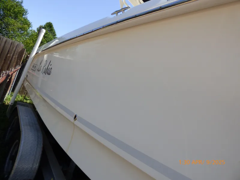 Slide: The Image of 2018 Boston Whaler 250 Outrage boat on trailer, side view. - 10
