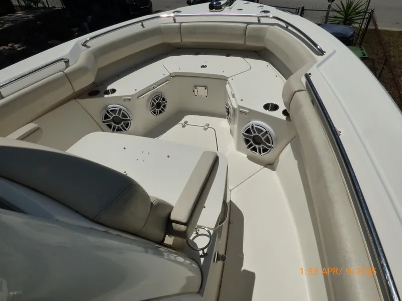 Slide: The Image of 2018 Boston Whaler 250 Outrage boat interior with seating and speakers. - 21