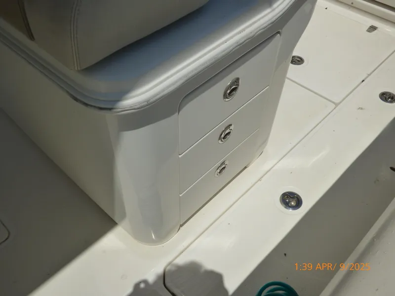 Slide: The Image of 2018 Boston Whaler 250 Outrage boat interior with storage drawers. - 40
