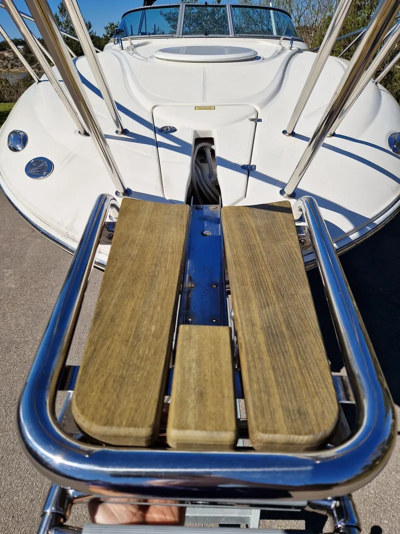Slide: The Image of 2006 Monterey 270 Cruiser boat with wooden swim platform and stainless steel rails. - 14