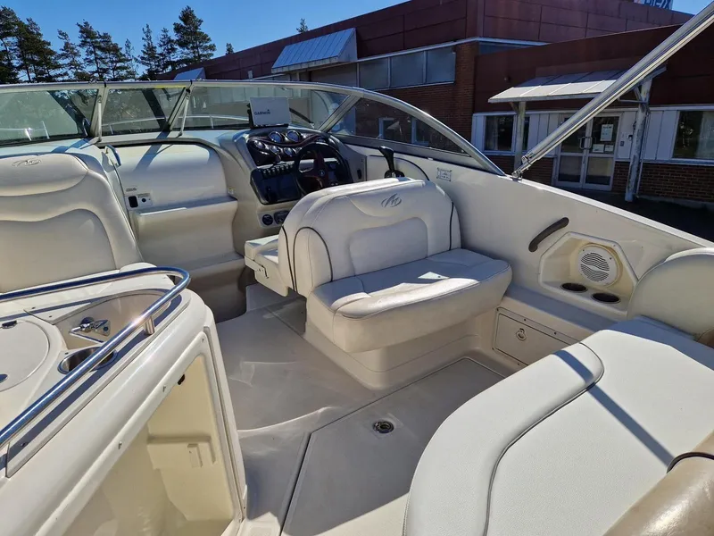 Slide: The Image of 2006 Monterey 270 Cruiser interior with beige seating and modern dashboard. - 18