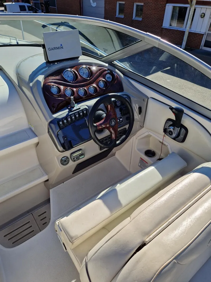 Slide: The Image of 2006 Monterey 270 Cruiser cockpit with Garmin navigation system and elegant dashboard design. - 19