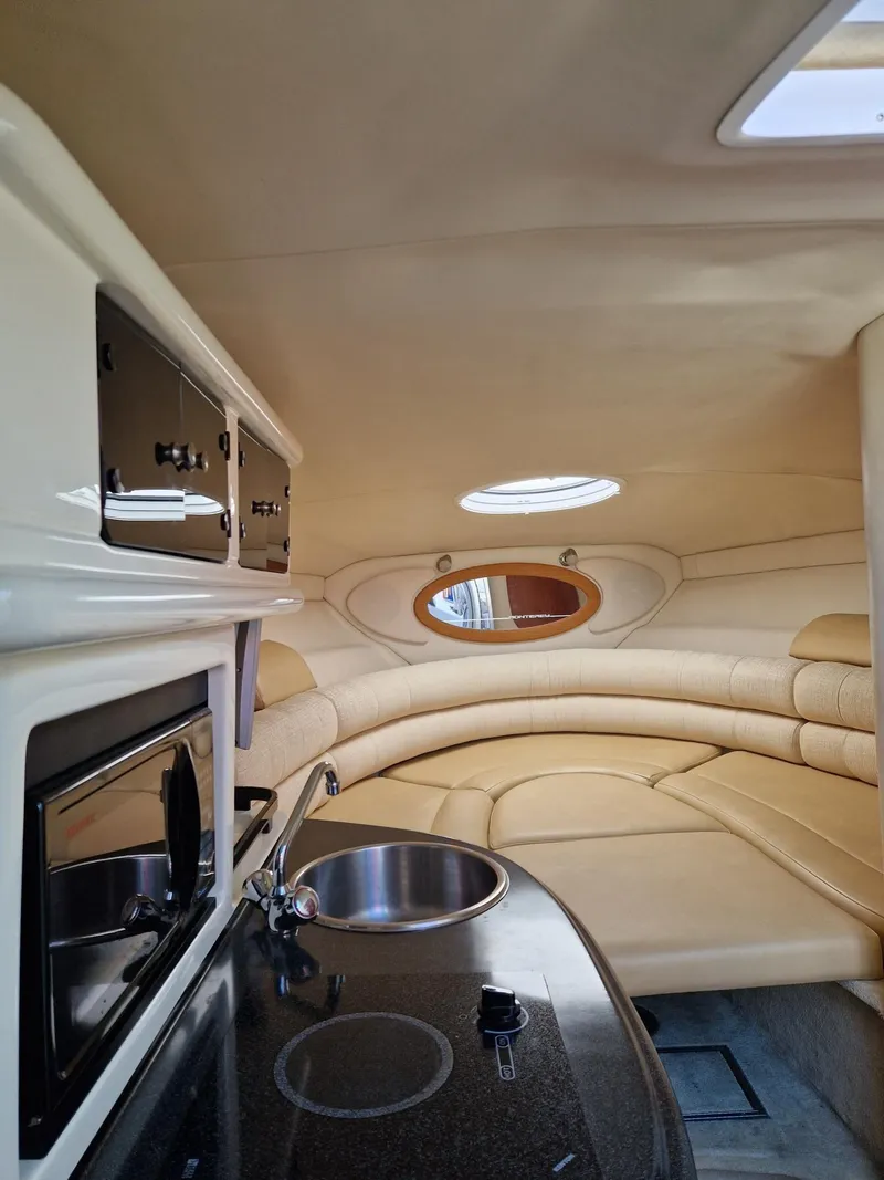 Slide: The Image of Interior of 2006 Monterey 270 Cruiser with kitchenette and seating area. - 23