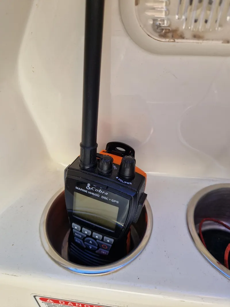 Slide: The Image of Handheld marine radio in a 2006 Monterey 270 Cruiser cup holder. - 32