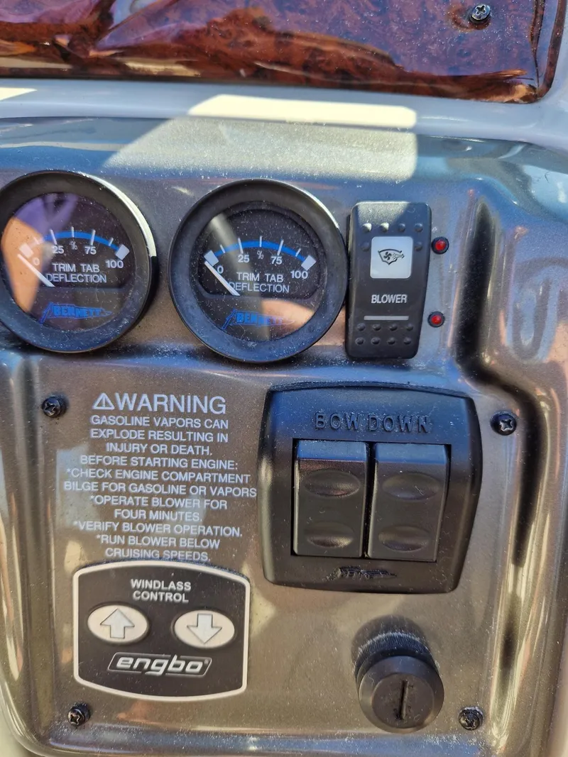 Slide: The Image of Control panel of a 2006 Monterey 270 Cruiser boat with gauges and warning labels. - 35