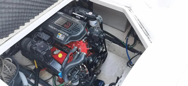 Slide: The Image of Engine compartment of a 2006 Monterey 270 Cruiser boat, showcasing detailed mechanical components. - 38