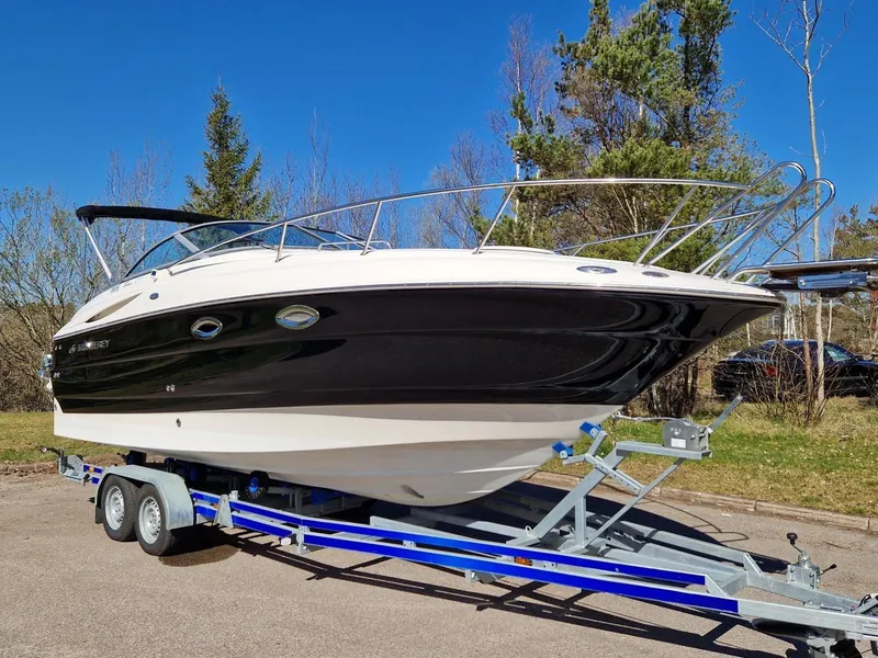 Slide: The Image of 2006 Monterey 270 Cruiser boat on trailer, parked outdoors. - 5