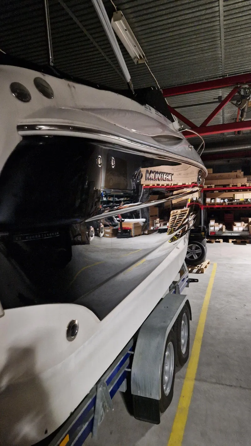 Slide: The Image of 2006 Monterey 270 Cruiser boat on trailer in indoor storage facility. - 8