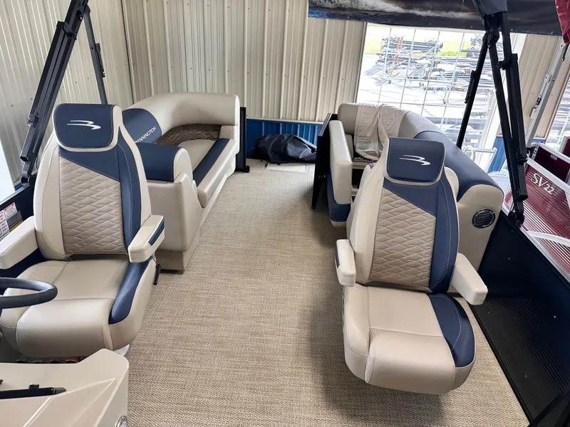 Slide: The Image of 2024 Bennington S Series 22 SSR pontoon boat interior with luxurious seating and modern design. - 4
