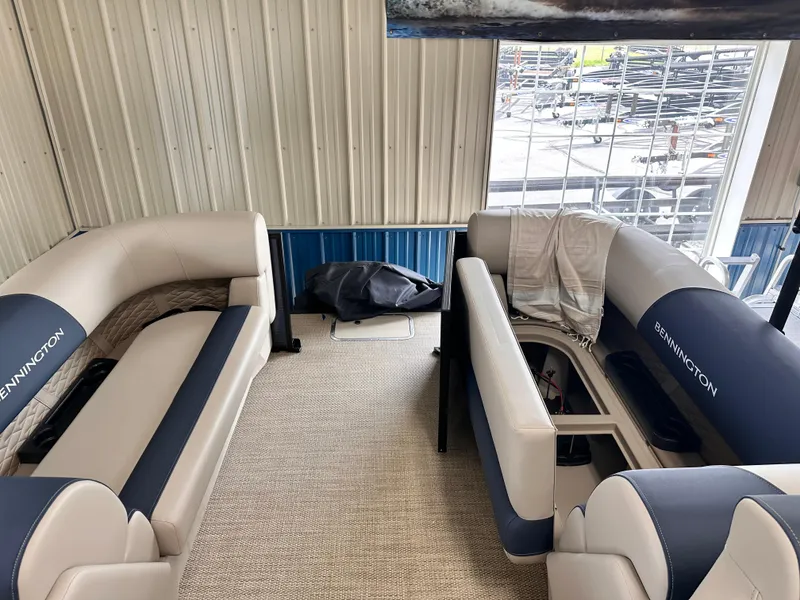 Slide: The Image of 2024 Bennington S Series 22 SSR pontoon boat interior with plush seating. - 5
