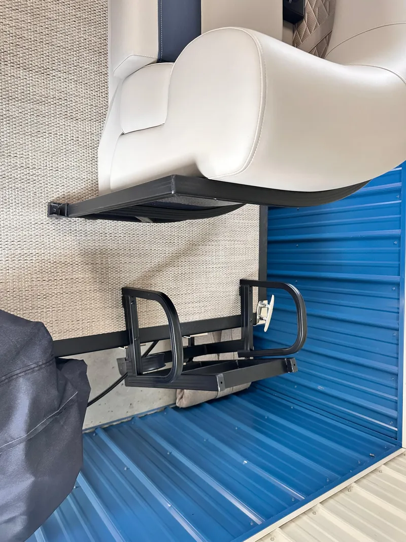 Slide: The Image of 2024 Bennington S Series 22 SSR boat interior with seating and blue paneling. - 6