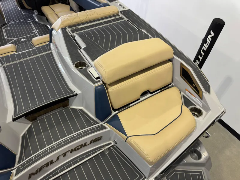 Slide: The Image of 2022 Nautique Super Air Nautique G23 Paragon interior with beige seating and sleek design. - 12
