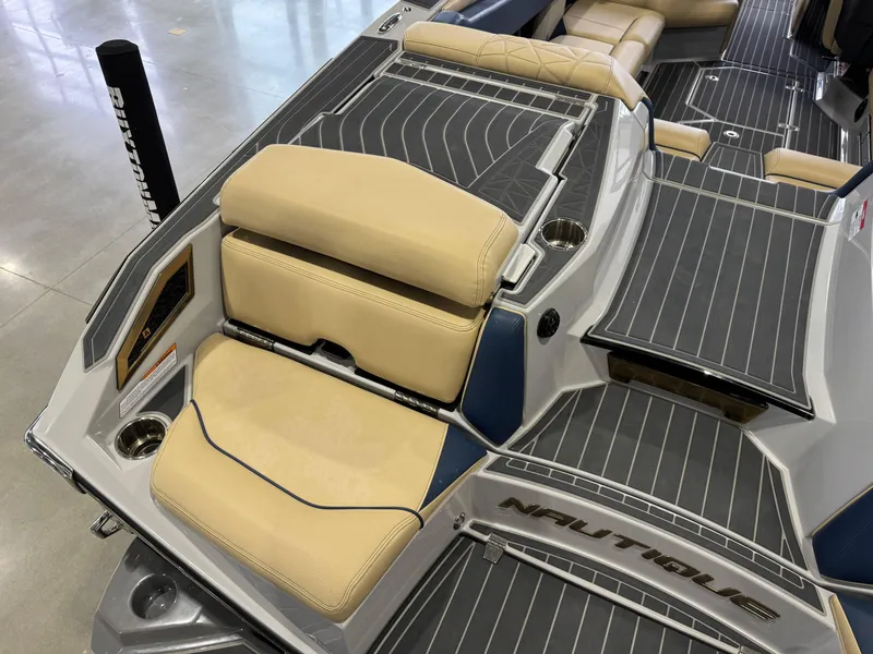 Slide: The Image of 2022 Nautique Super Air Nautique G23 Paragon interior with beige seating and sleek design. - 13
