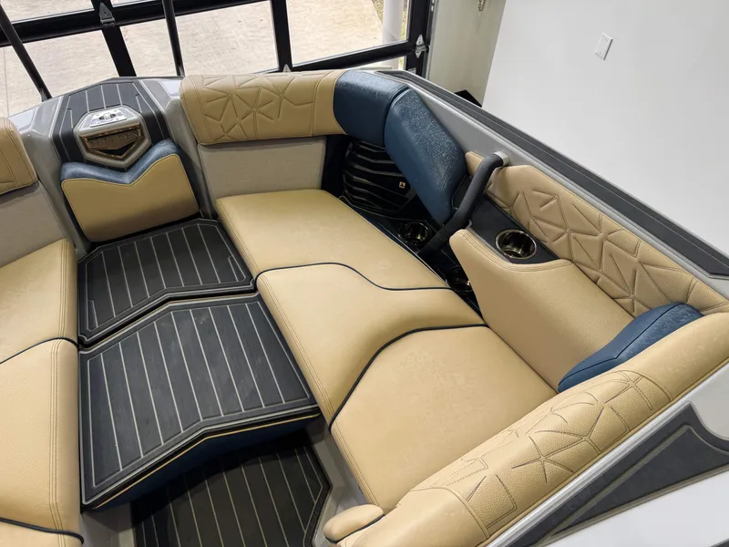 Slide: The Image of 2022 Nautique Super Air Nautique G23 Paragon interior with luxurious seating and cup holders. - 22
