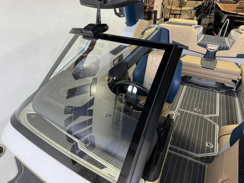 Slide: The Image of 2022 Nautique Super Air Nautique G23 Paragon interior with luxurious seating and modern dashboard. - 24