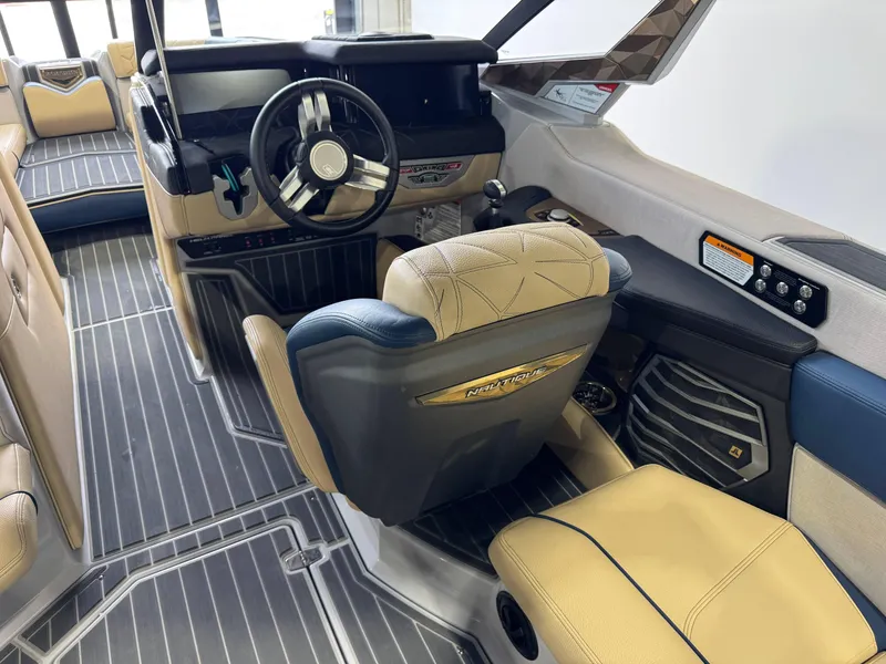 Slide: The Image of 2022 Nautique Super Air Nautique G23 Paragon interior with luxury seating and modern dashboard. - 27