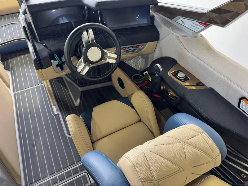 Slide: The Image of 2022 Nautique Super Air Nautique G23 Paragon cockpit with luxury seating and advanced controls. - 28