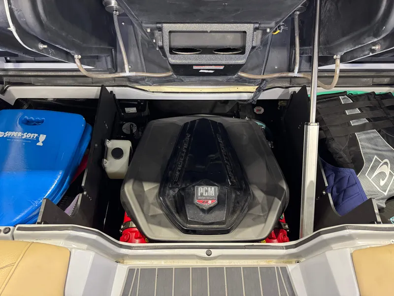 Slide: The Image of 2022 Nautique Super Air Nautique G23 Paragon engine compartment with PCM engine and storage. - 31
