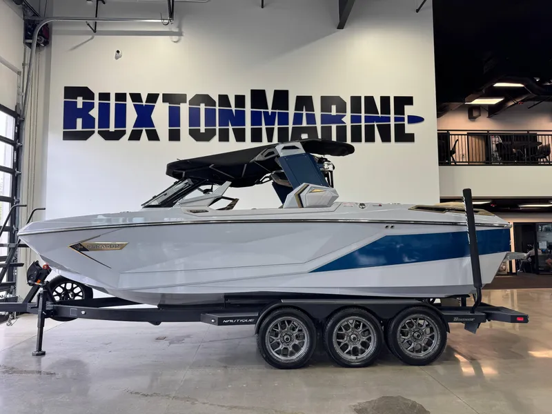 Slide: The Image of 2022 Nautique Super Air Nautique G23 Paragon boat on trailer at Buxton Marine showroom. - 4